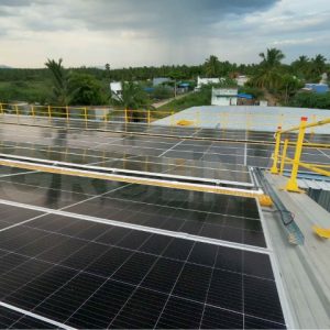 Solar panels installed on the roof of an industrial warehouse in dindigul